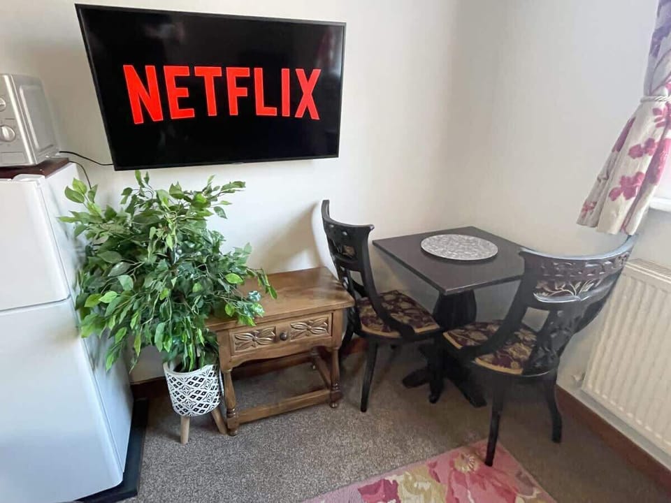 The Living Area: there is a handy table and chairs for you to enjoy a meal on during your visit.