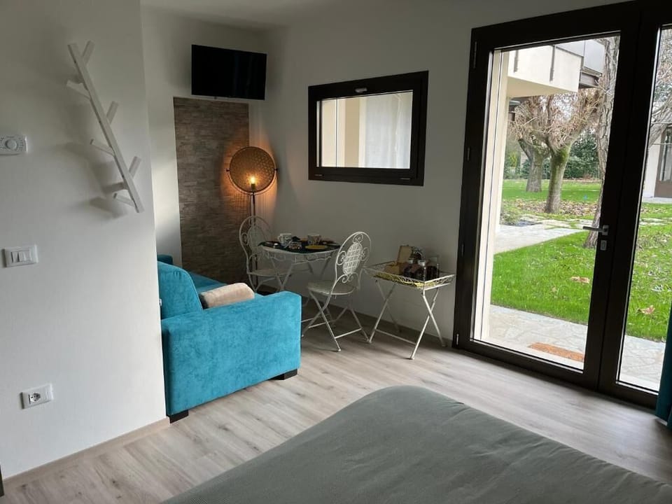 Deluxe Quadruple Room, Multiple Beds, Smoking, Park View | Pillowtop beds, in-room safe, desk, laptop workspace
