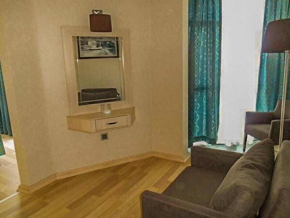Suite, Sea View | Living area | LCD TV