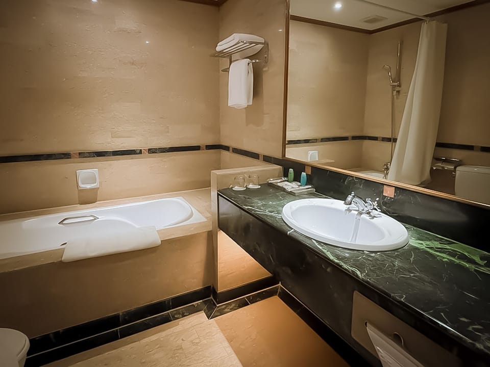 Executive Double Room | Bathroom | Shower, free toiletries, hair dryer (on request), slippers