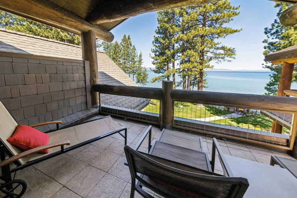 Step outside to your private balcony and soak in stunning lake views framed by tall pines. Relax on the lounge chairs with your morning coffee or unwind as the day fades away.