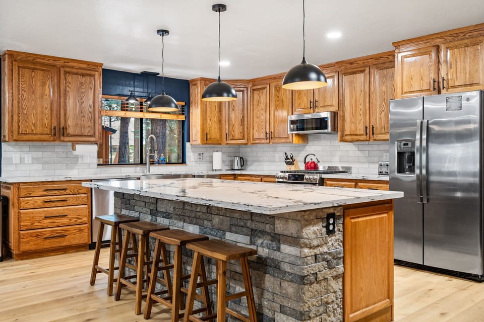 The fully remodeled chef’s kitchen is designed for entertaining, 