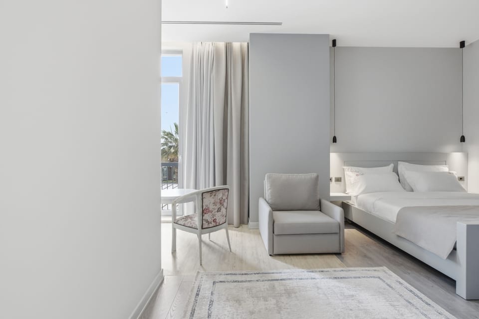 Deluxe Triple Room, Partial Sea View | Desk, free WiFi