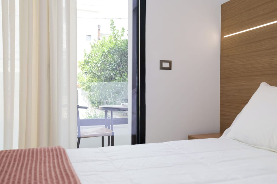 Superior Double Room, Balcony, Courtyard View | In-room safe, laptop workspace, blackout drapes, iron/ironing board