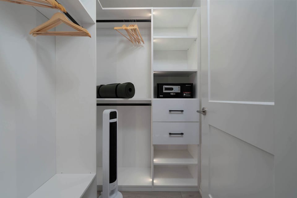 Spacious closet with built-in shelving and ample storage