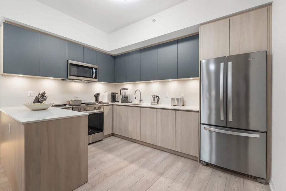 Modern kitchen with stainless steel appliances and sleek finishes