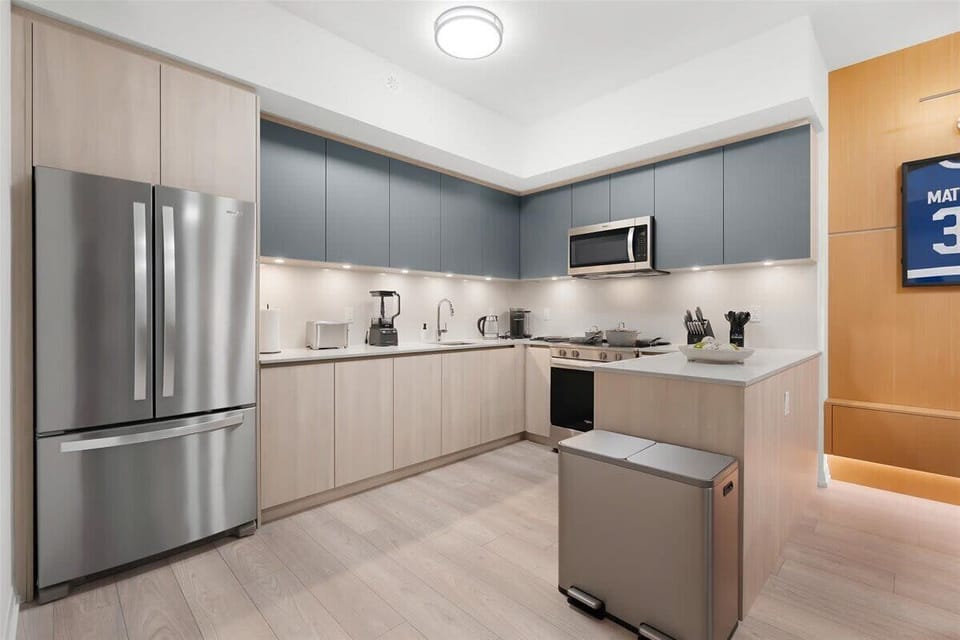 Modern kitchen with stainless steel appliances and sleek finishes