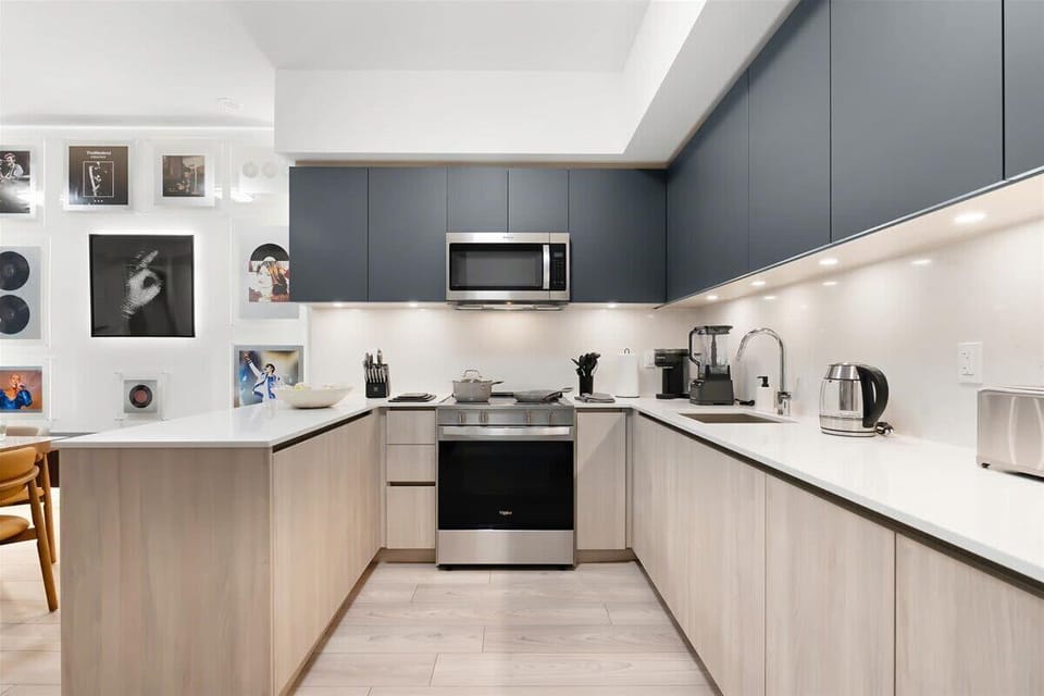 Modern kitchen with stainless steel appliances and sleek finishes