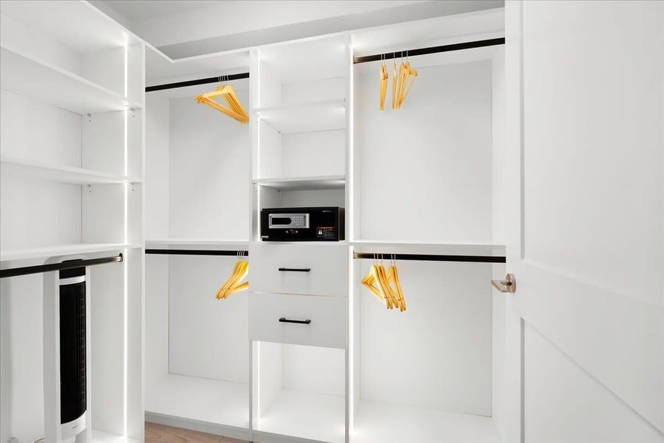 
Spacious closet with built-in shelving and ample storage