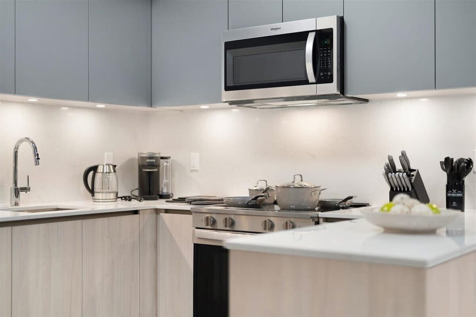 Modern kitchen with stainless steel appliances and sleek finishes