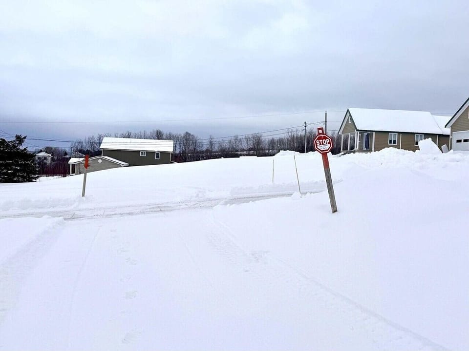 Winter Exterior | Snow Covered Landscape & Residential Surroundings