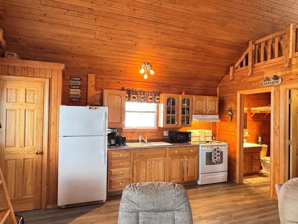 Kitchen | Wood Cabinetry & Compact Appliance Suite | Open Cabin Layout
