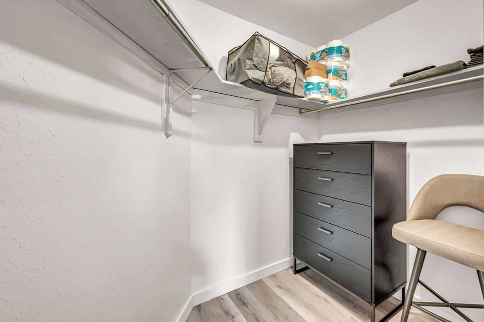 Handy closet space w/ shelving, drawers & extra storage to keep things tidy.
