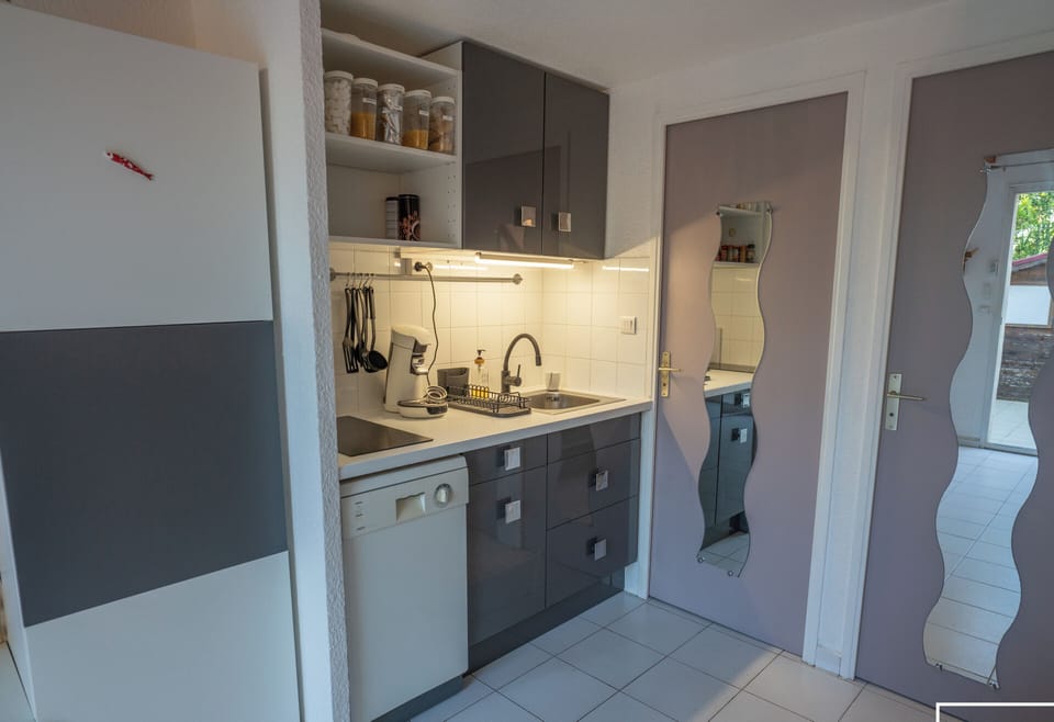 Open-plan living area with a fitted kitchen