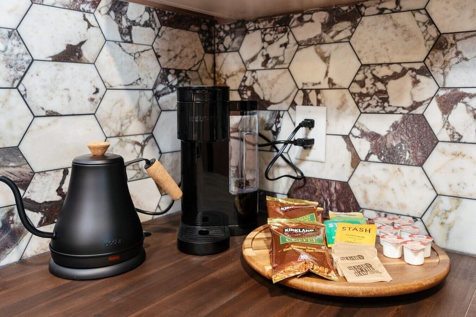 ☕ Fuel your mornings at the ultimate coffee bar, complete with a gooseneck kettle and complimentary blends.