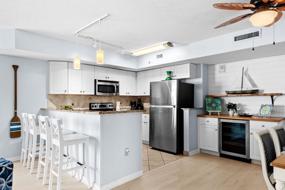 Fully Equipped Kitchen with barstools and wine fridge
