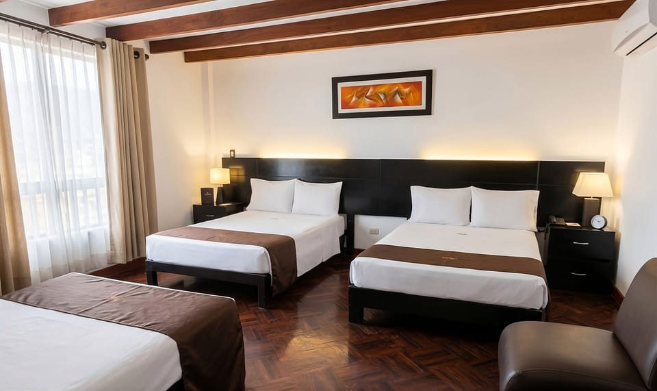 Deluxe Triple Room, City View | Down comforters, minibar, in-room safe, desk