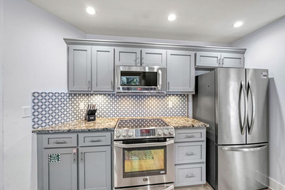 Tile backsplash adds a subtle design detail to the space.