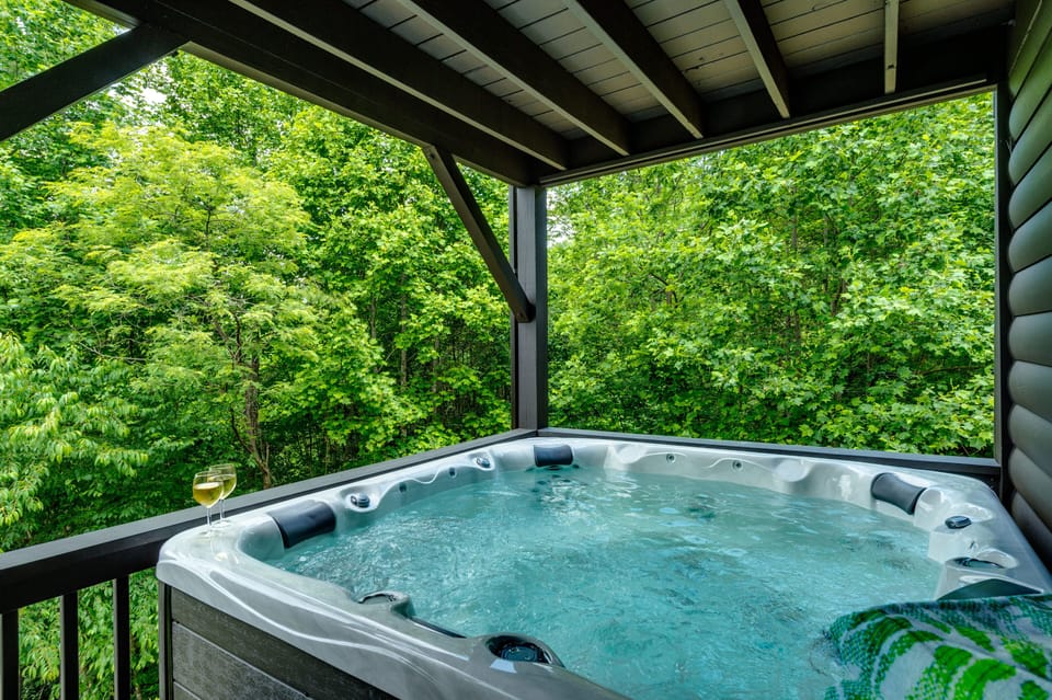 Private covered hot tub with peaceful forest views