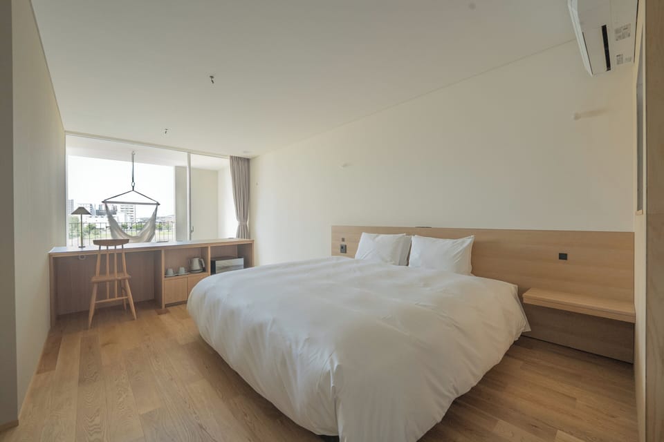 Standard Double Room, River View | In-room safe, desk, WiFi (free), bed sheets