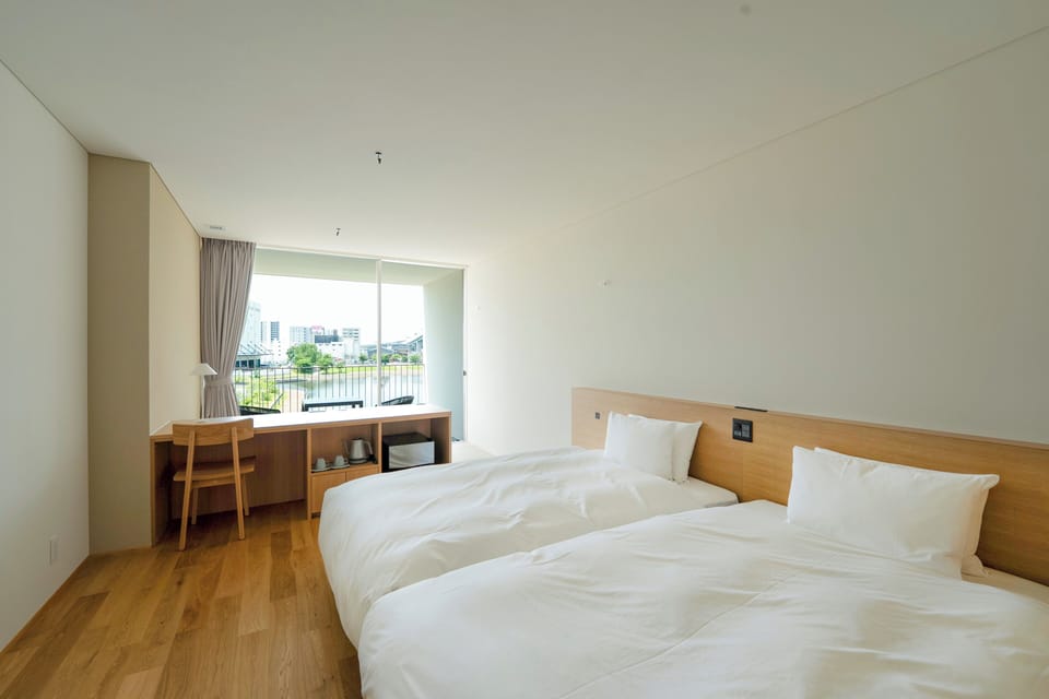 Basic Twin Room, River View | In-room safe, desk, free WiFi, bed sheets