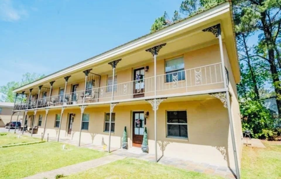 Charming two-story stay with covered balcony and classic Southern style