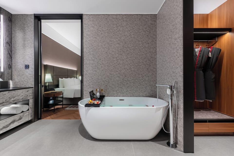Premier Suite, City View | Bathroom | Shower, hair dryer, slippers, towels