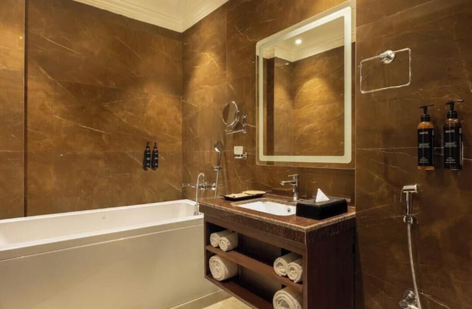 Luxury Suite, Non Smoking, Hill View | Bathroom | Separate tub and shower, slippers, towels, soap