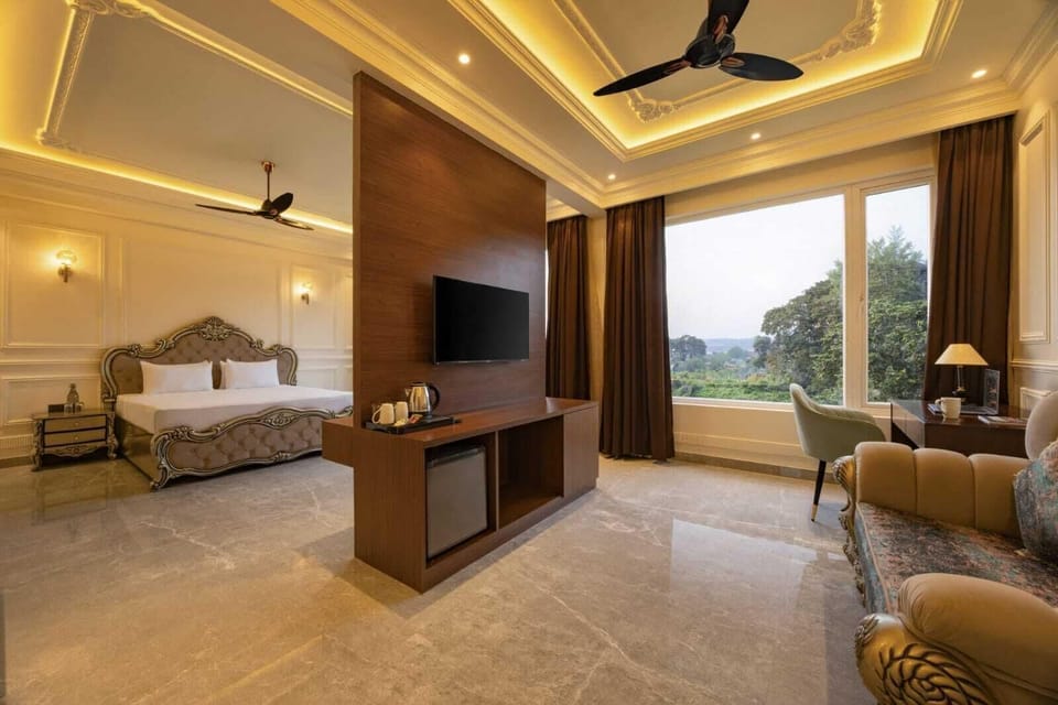 Luxury Suite, Non Smoking, Hill View | Desk, laptop workspace, iron/ironing board, free WiFi