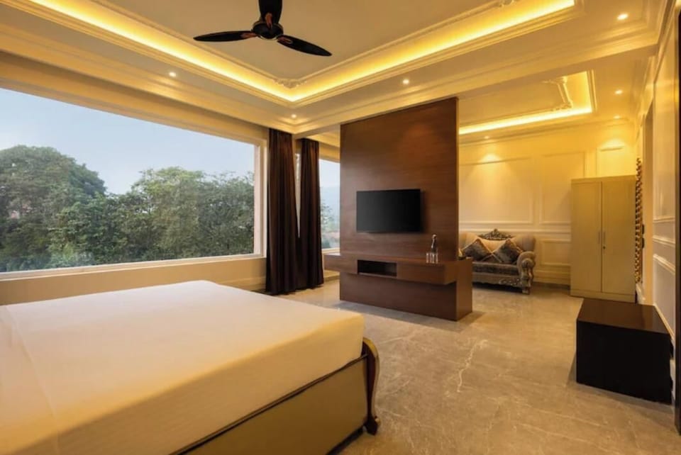 Luxury Suite, Non Smoking, Hill View | Desk, laptop workspace, iron/ironing board, free WiFi