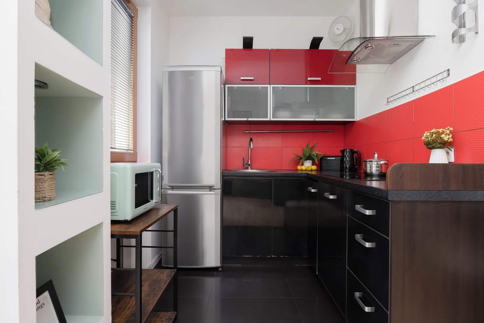 The sleek design of the kitchenette blending seamlessly with the living area.