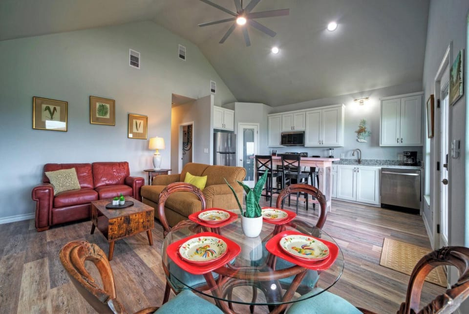Open dining area with vaulted ceiling.