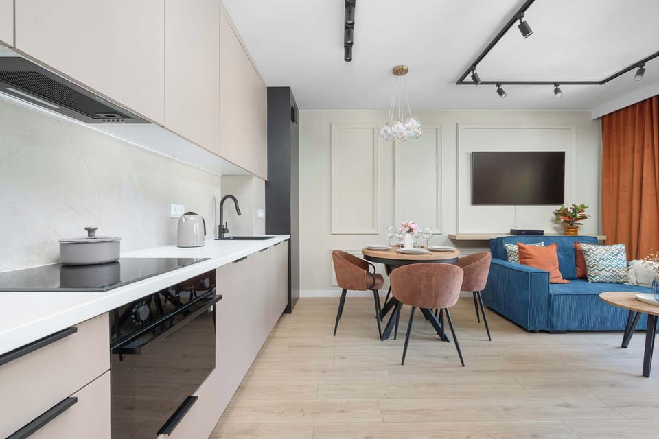 Modern kitchen with sleek cabinetry, built-in appliances, and minimalist finishes.