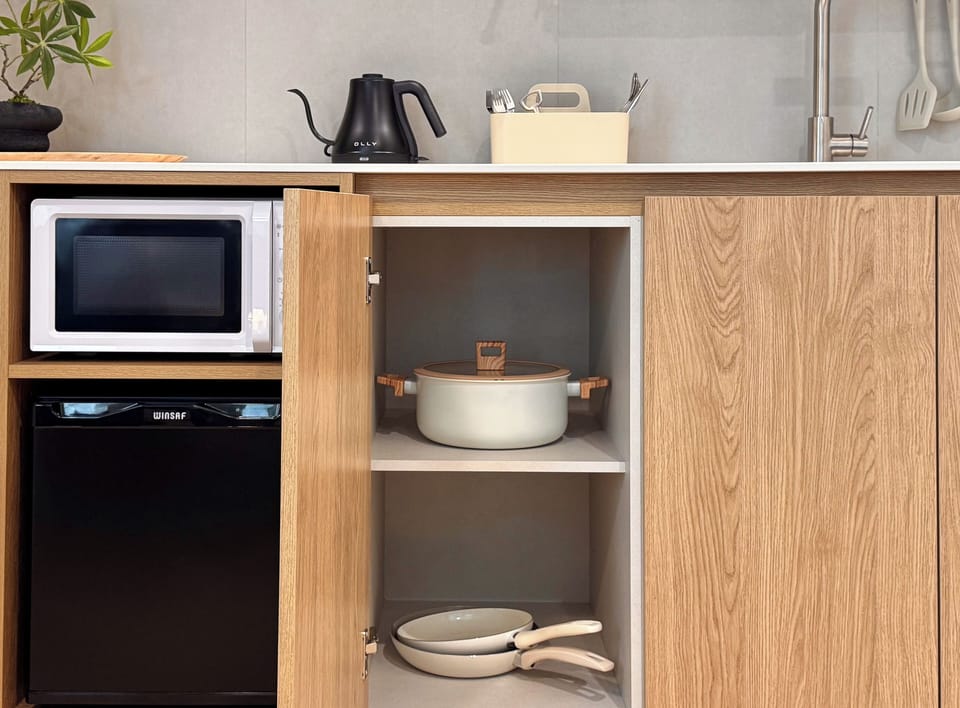 Mini-fridge, microwave, cookware/dishes/utensils