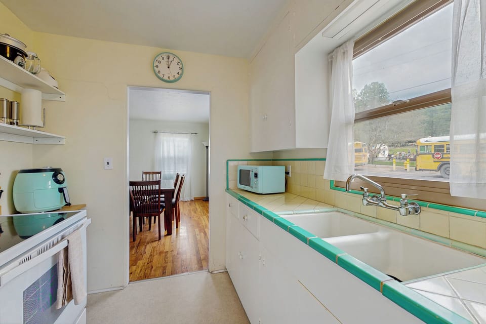 View of kitchen area and dining area.