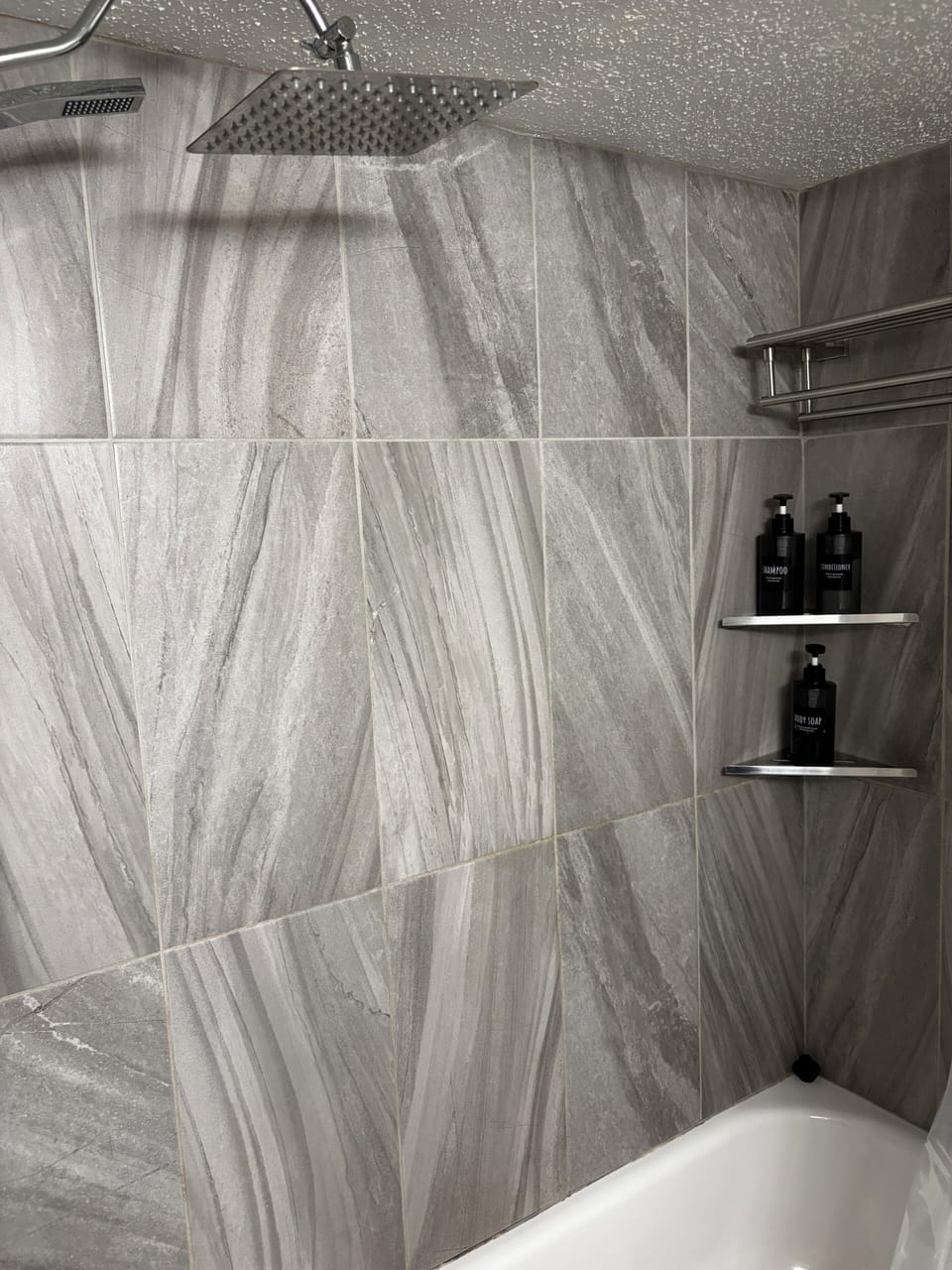 Combined shower/tub, free toiletries, hair dryer, slippers
