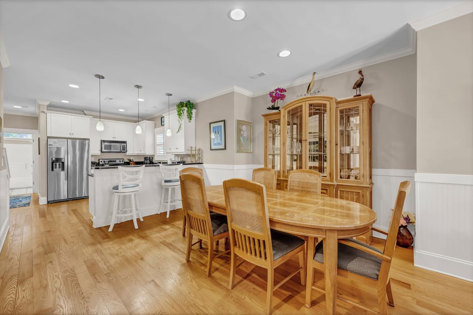 Step into a warm open-concept space where your kitchen flows into an elegant dining area. Gather around the table for memorable meals, then relax at the breakfast bar while planning your next adventure.
