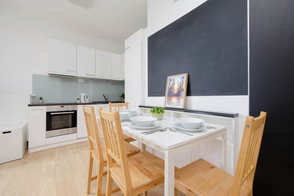 The sleek design of the kitchenette blending seamlessly with the living area.