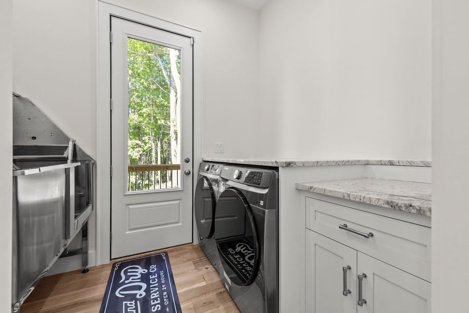 Utility room with washer/dryer and sink...