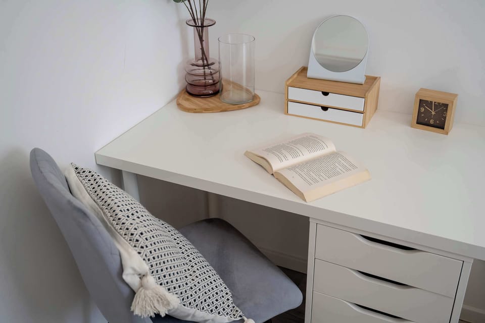 Functional workspace with desk and modern accessories.