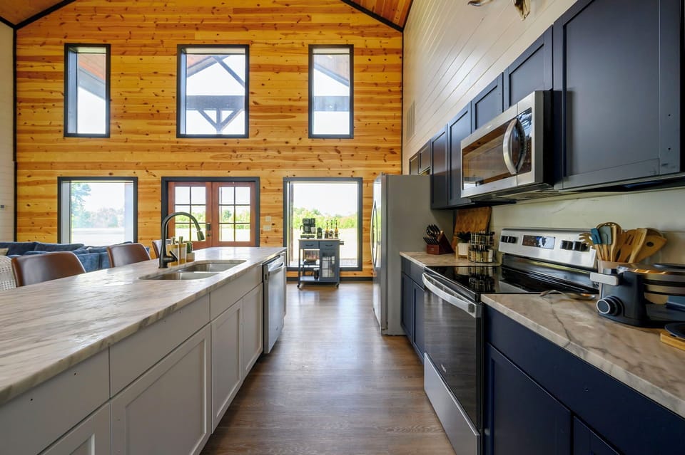 Fully stocked for real cooking — crockpot, waffle maker, blender, bakeware, and every utensil you'll need. Kid-friendly dishes and a high chair included.
