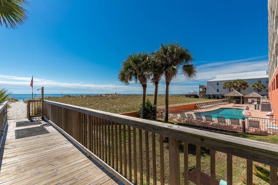 Boardwalk to beach with shower to wash off