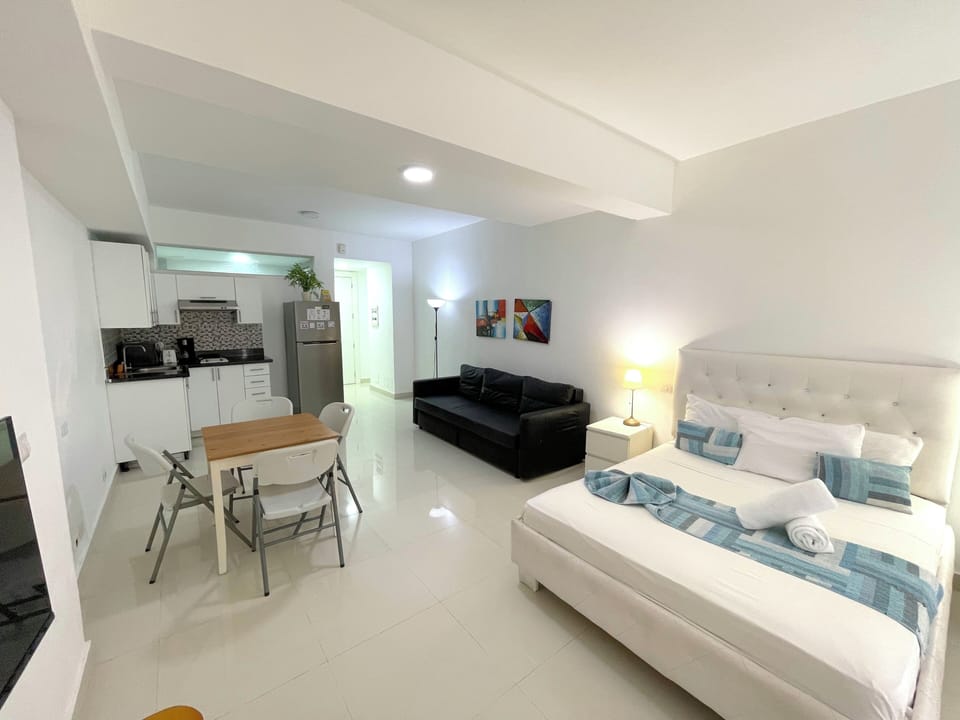 Deluxe Studio Suite, City View | Private kitchen | Fridge, microwave, stovetop, coffee/tea maker