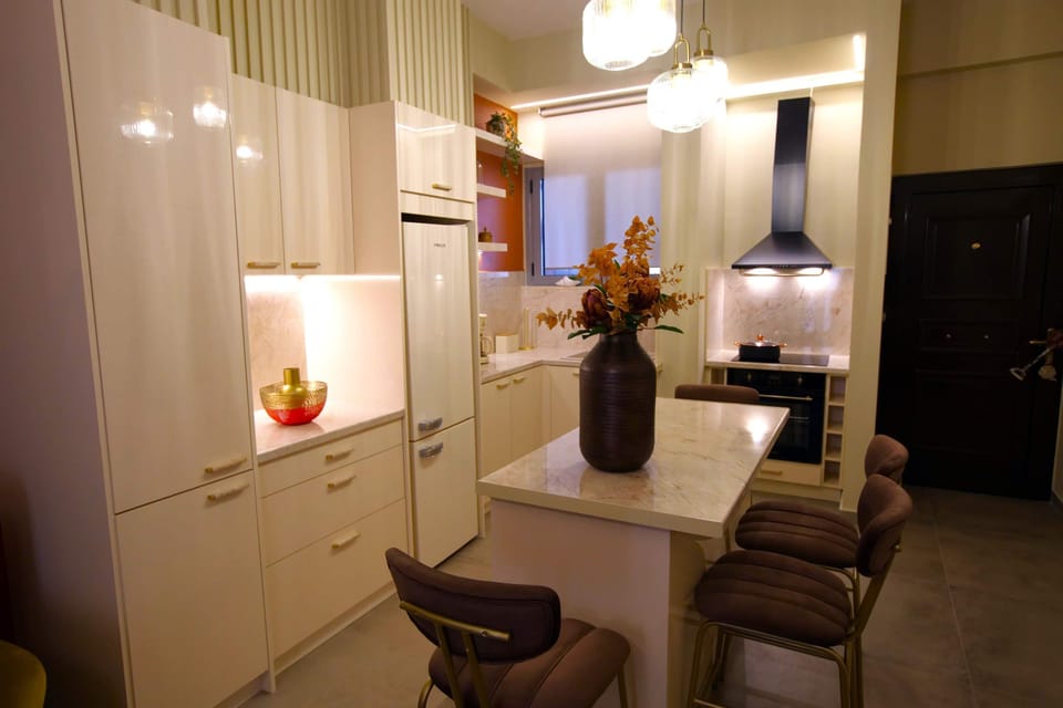 The dining area sits at the centre of the apartment, offering a comfortable place to enjoy meals, plan the day ahead, or relax with a coffee in the evening.