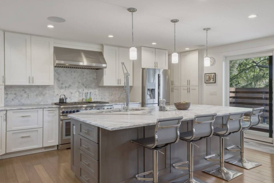 Fully equipped chef`s kitchen with high end appliances and bar seating