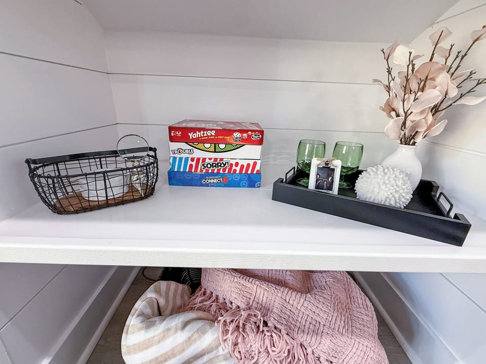Board games and decor to make it feel like home included