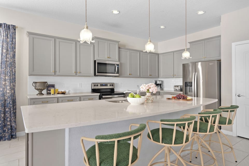 Kitchen island with pendant lights and fairy-tale dining space