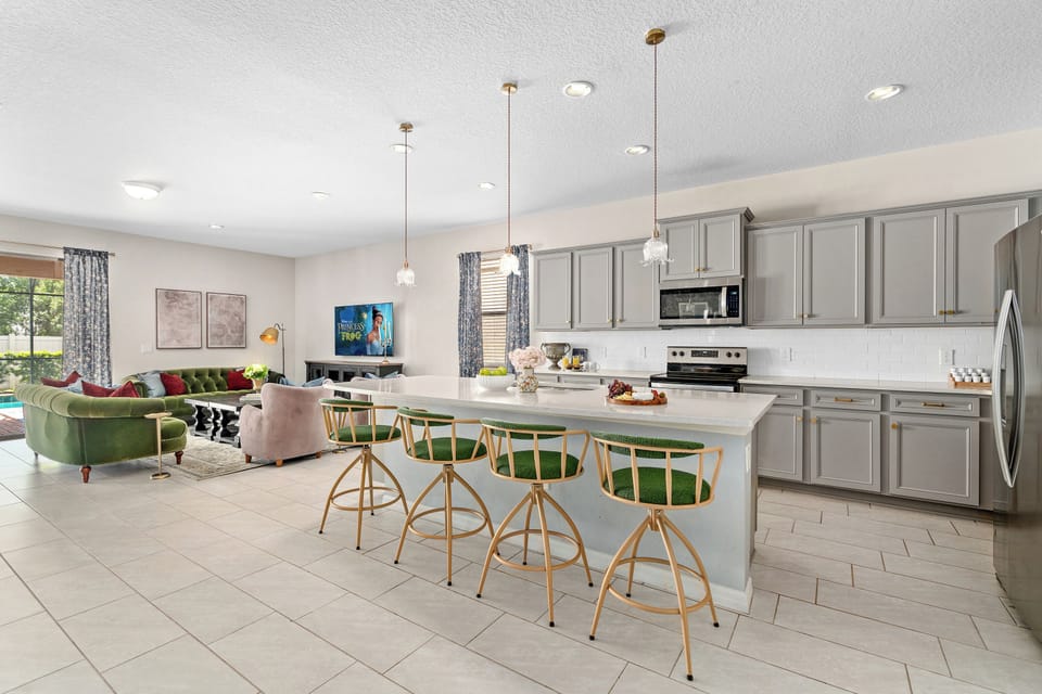 Open kitchen with island seating for princess family meal prep