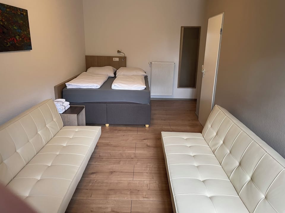 Triple Room, Park View | Desk, laptop workspace, blackout drapes, free WiFi