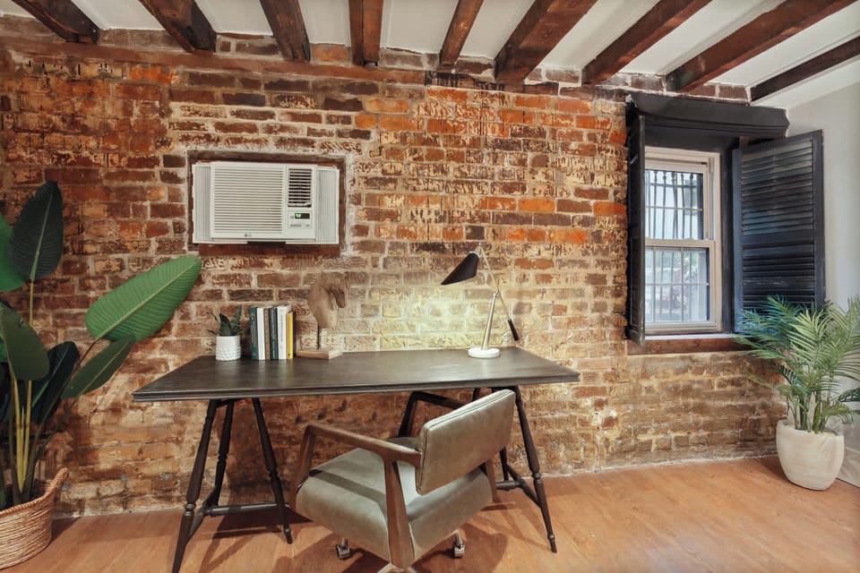 Bedroom 1 | King Bed and Daybed with Trundle with Brick Wall Detail | Garden Level — Unit on One Level